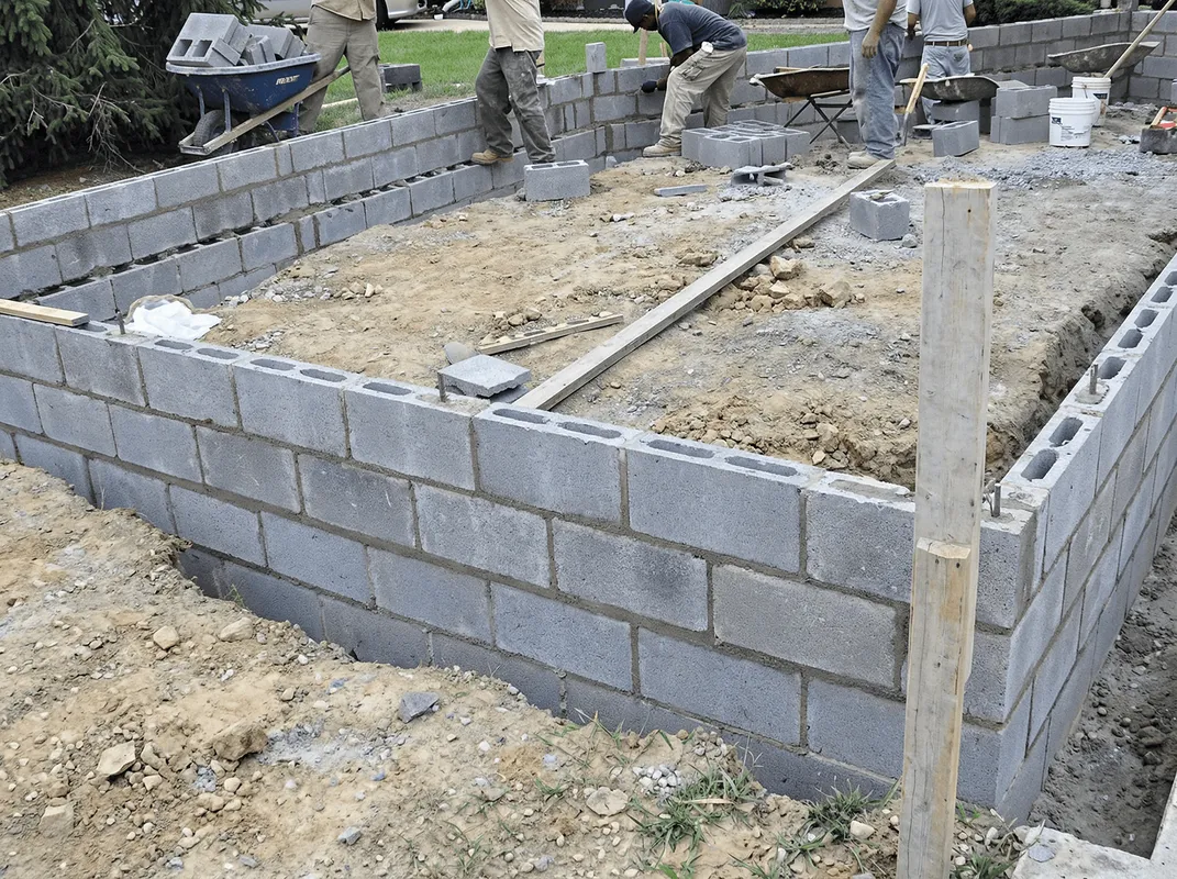 Professionals building a foundation with blocks in Cambridge, MA