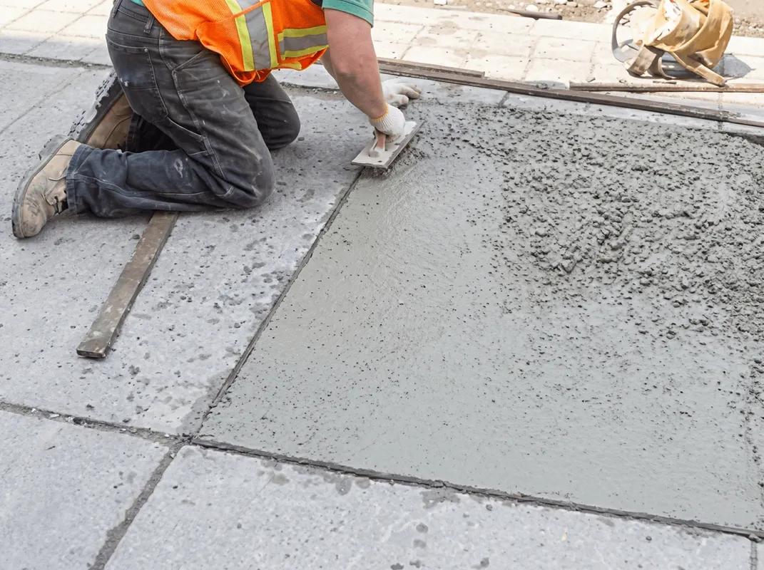 Professional repairing a concrete floor in Cambridge, MA