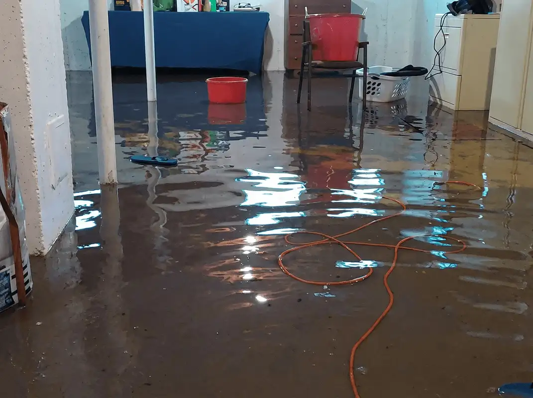Basement with boiler, cabinets and washing machine completely flooded in Cambridge, MA